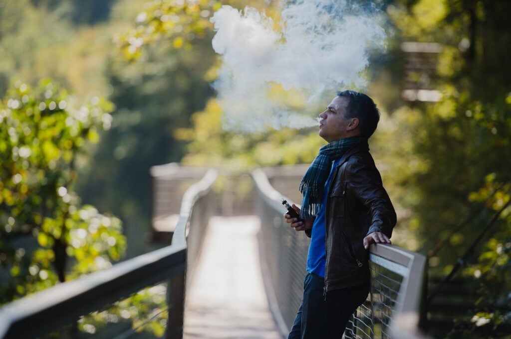 Young man vaping