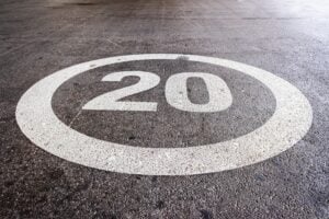 Mark on the ground at maximum speed at 20 miles per hour on the ground of a residential road.